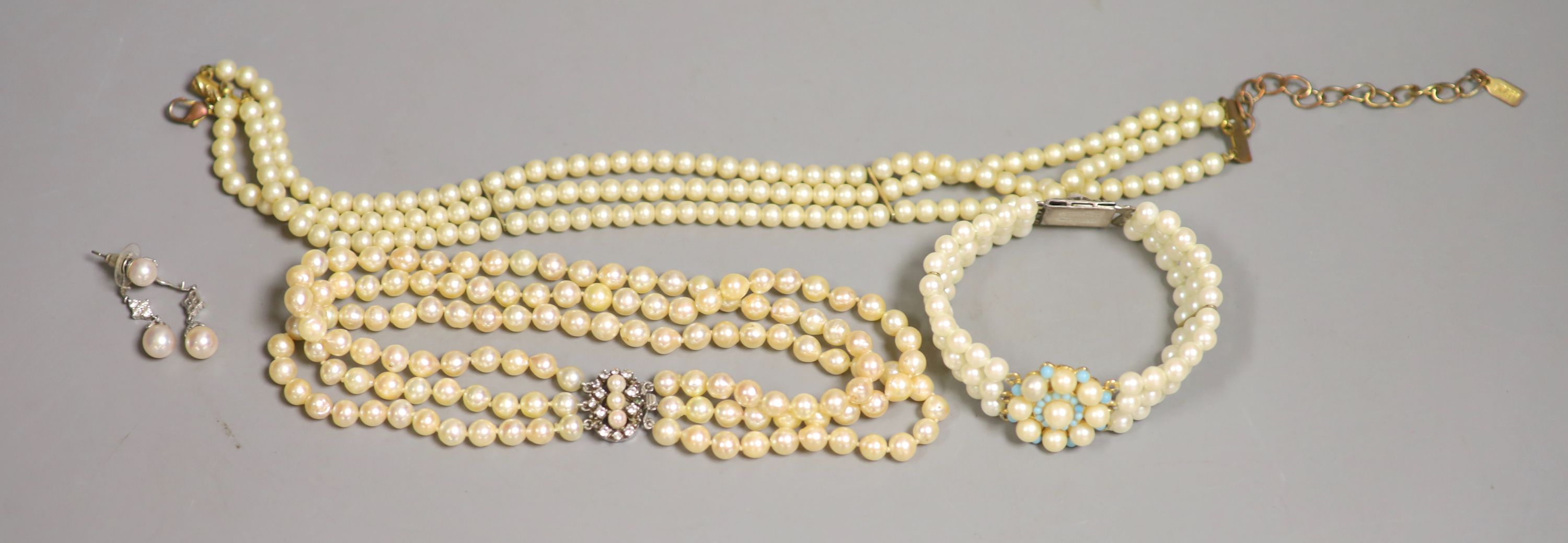 A triple strand cultured pearl choker necklace and four other items.